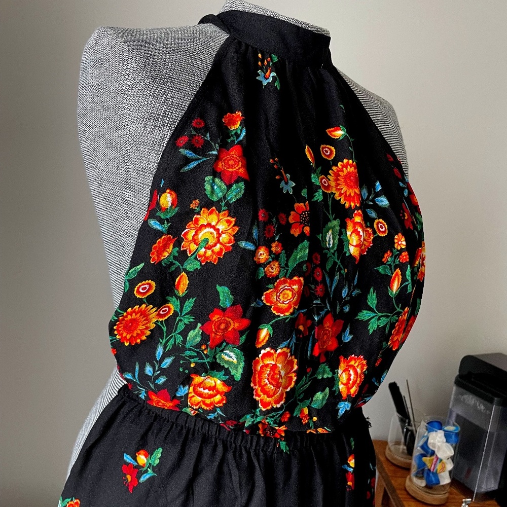 Forever 21 black and bright floral printed jumpsuit. Halter/Backless. Size L.